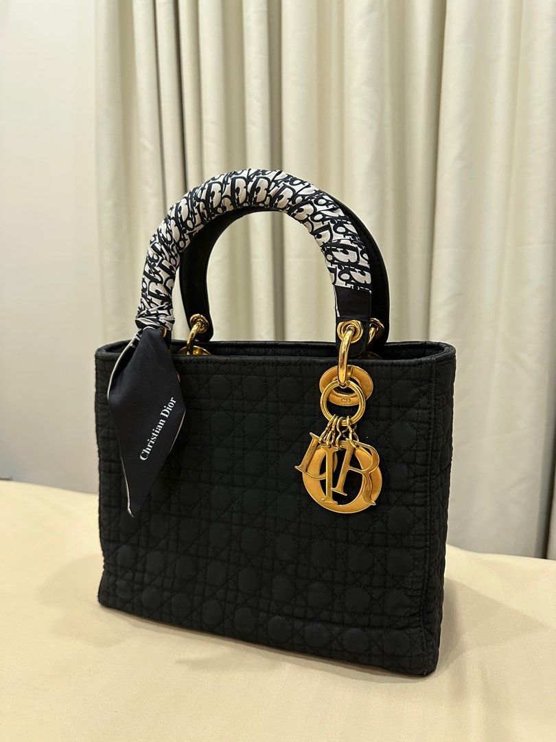 Vintage Lady Dior Cannage Nylon (Category: Luxury Bags & Wallets) located in Quezon City. Submitted by princessbtsta (Listing ID 1317071361, Image 3). Description: 100% Authentic Vintage Lady Dior Cannage Nylon Medium size Condition: 9/10 Inclusion: dustbag, free twilly and bag organizer Can send more photos upon request Slightly negotiable for sure buyers.