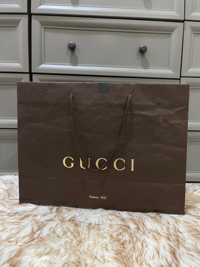 Authentic Gucci Embosed Paperbag (Category: Luxury Bags & Wallets) located in Quezon City. Submitted by jewelraestoyshop (Listing ID 1312225738, Image 2). Description: Authentic Gucci Embossed Paperbag Large ₱400 Location: Project 4, QC.