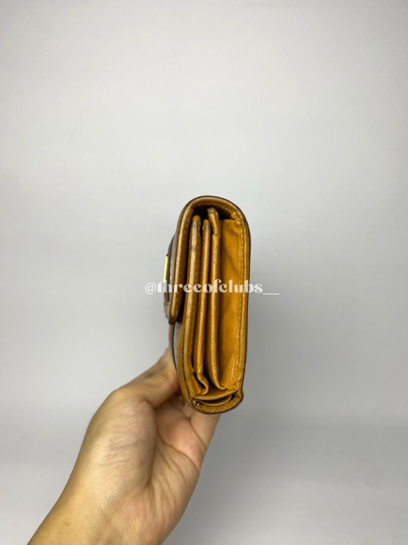 MCM Visetos Cognac Medium Trifold Wallet (Category: Luxury Bags & Wallets) located in Quezon City. Submitted by threeofclubs__ (Listing ID 1312274624, Image 3). Description: Very good condition 100% GA Clean leather body Clean leather interior Bill slot, card slots, clear picture frame No rubs No cracks Minimal dirt stains Other signs of usage always zoom photos ♣ 1 day reservation only. ♣ Please manage your expectations when buying preloved item