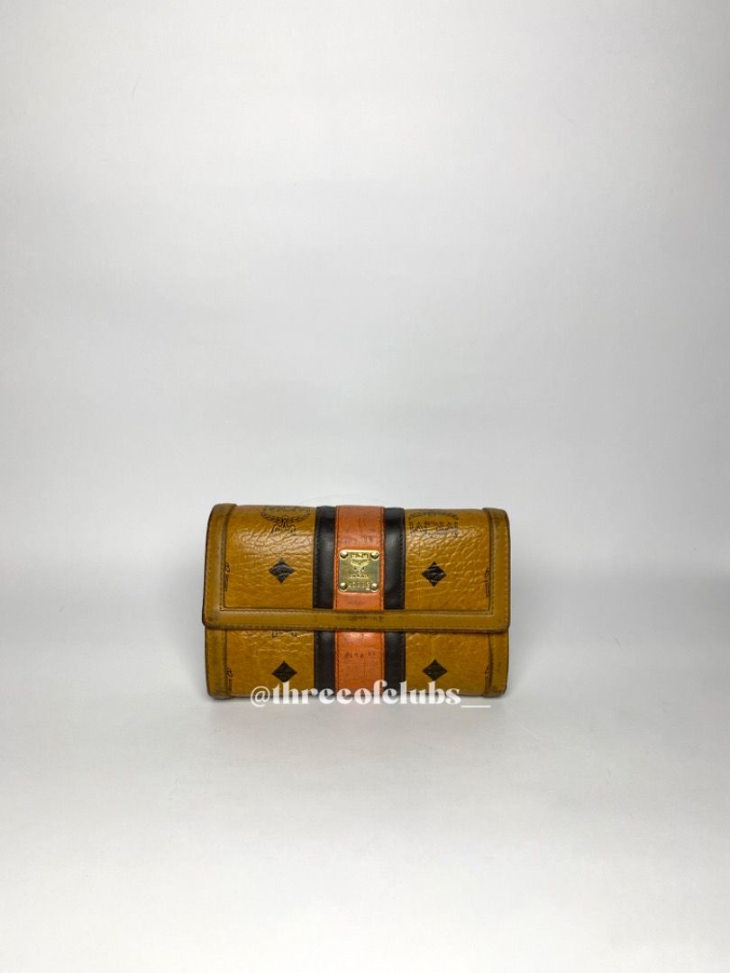 MCM Visetos Cognac Medium Trifold Wallet (Category: Luxury Bags & Wallets) located in Quezon City. Submitted by threeofclubs__ (Listing ID 1312274624, Image 1). Description: Very good condition 100% GA Clean leather body Clean leather interior Bill slot, card slots, clear picture frame No rubs No cracks Minimal dirt stains Other signs of usage always zoom photos ♣ 1 day reservation only. ♣ Please manage your expectations when buying preloved item