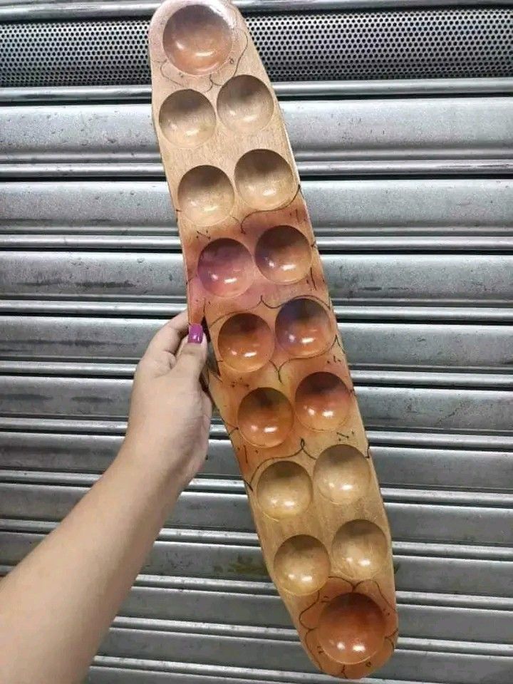 sungka (Category: Vintage Collectibles) located in Manila. Submitted by minidivisoria (Listing ID 1312135219, Image 3). Description: SUNGKA🥰✌️ SMALL 350 PESOS RS MEDIUM 390 PESOS RS LARGE 450 PESOS RS (SIGAY INCLUDED) - A traditional count and capture game of the Philippines. It involves dropping shells into large holes on a canoe-shaped board. "Tara Laro tayo" extra pack of sigay - 100 pesos.