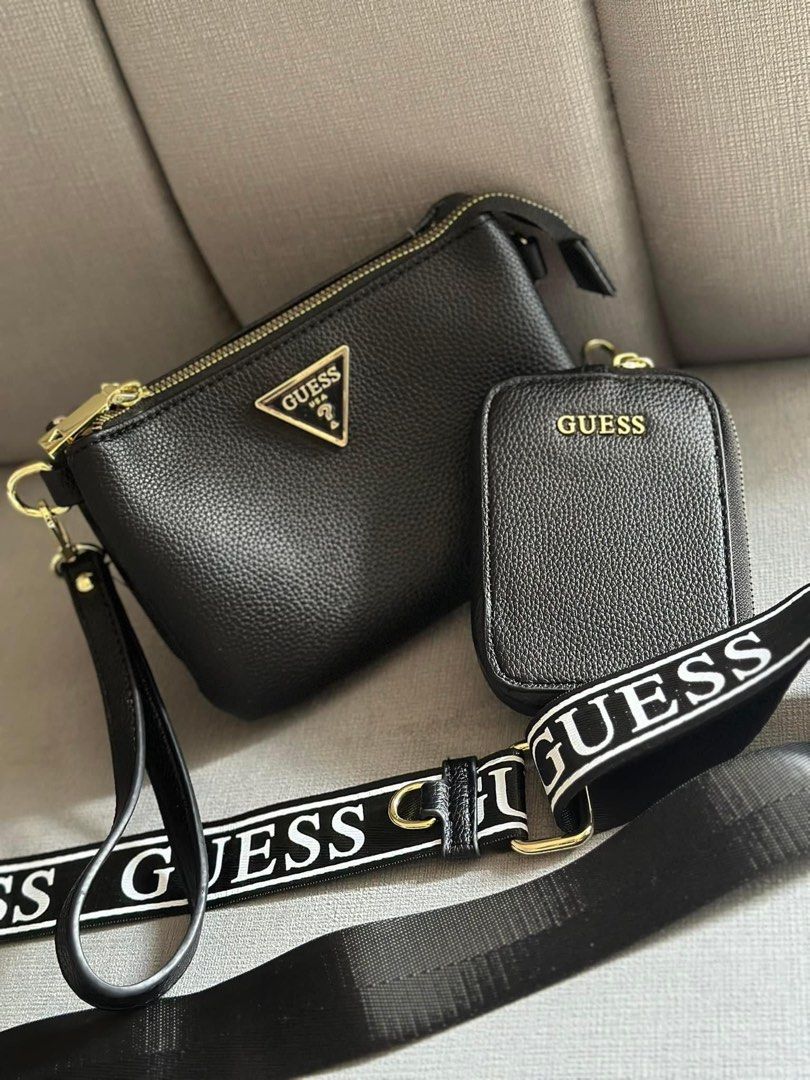 Guess sling bag (Category: Luxury Bags & Wallets) located in Valenzuela. Submitted by smjhsmnlzcn (Listing ID 1317285762, Image 1). Description: ACTUAL PHOTOS 🖤 2 strap with coin purse ✅sling bag ✅pouch 3 compartments very spacious ☑️ With dust bag✔️ BEST SELLER ❗️limited stocks only. Fixed Price💪 lowest price napo :).