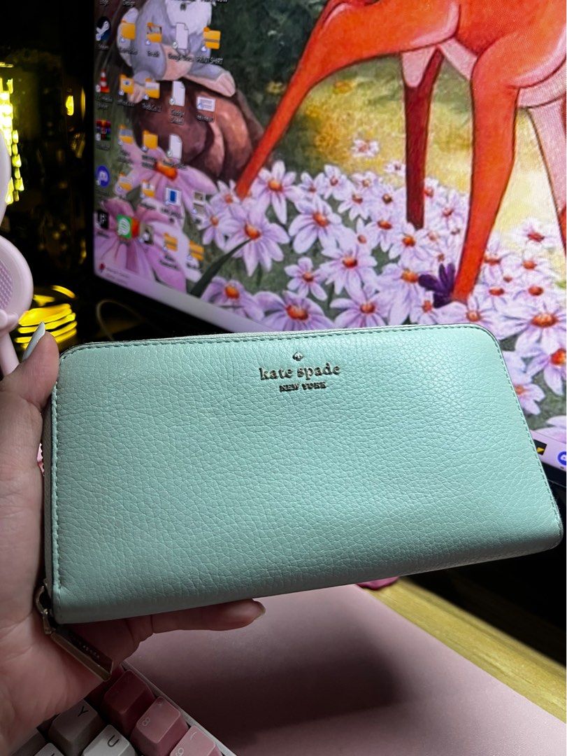 Kate Spade Leila Large Continental Wallet (Category: Luxury Bags & Wallets) located in Quezon City. Submitted by trisb. (Listing ID 1311138318, Image 3). Description: Bought from Japan 🇯🇵 Color: Sage Green Original Price: $229 3.9” hx7.7” Pebbled leather Metal pinmount logo Two way spade jacquard lining Interior: 12 credit card slots, 2 slip pockets, zip coin compartment, 3 gusset compartments Exterior: slip pocket on front Zip closure #Pouchwa