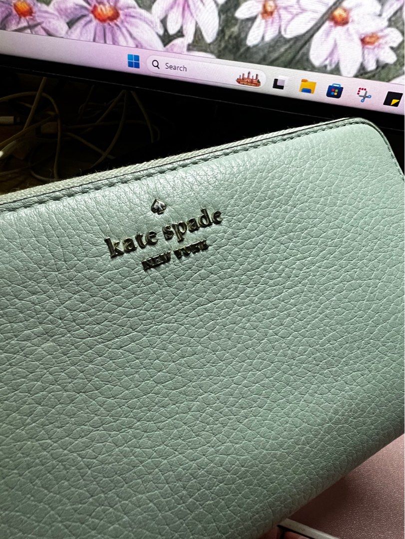 Kate Spade Leila Large Continental Wallet (Category: Luxury Bags & Wallets) located in Quezon City. Submitted by trisb. (Listing ID 1311138318, Image 2). Description: Bought from Japan 🇯🇵 Color: Sage Green Original Price: $229 3.9” hx7.7” Pebbled leather Metal pinmount logo Two way spade jacquard lining Interior: 12 credit card slots, 2 slip pockets, zip coin compartment, 3 gusset compartments Exterior: slip pocket on front Zip closure #Pouchwa