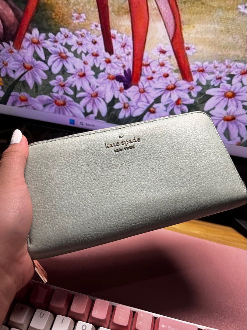 Kate Spade Leila Large Continental Wallet (Category: Luxury Bags & Wallets) located in Quezon City. Submitted by trisb. (Listing ID 1311138318, Image 1). Description: Bought from Japan 🇯🇵 Color: Sage Green Original Price: $229 3.9” hx7.7” Pebbled leather Metal pinmount logo Two way spade jacquard lining Interior: 12 credit card slots, 2 slip pockets, zip coin compartment, 3 gusset compartments Exterior: slip pocket on front Zip closure #Pouchwa