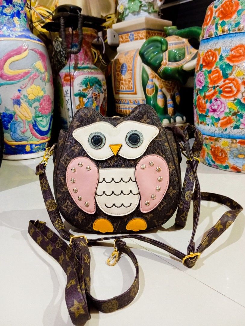 LV owl sling n backpack