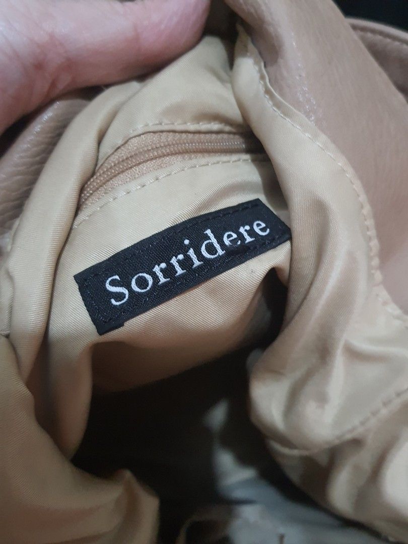 Sorridere 2Way Sling Bag (Category: Shoulder Bags) located in Quezon City. Submitted by pinksgate31 (Listing ID 1317211342, Image 2). Description: 2Way Browm leather bag.Like new.