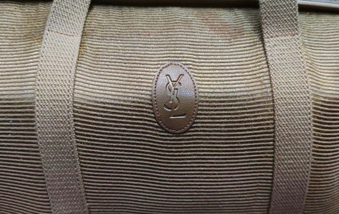 VINTAGE YSL TOTE (Category: Luxury Bags & Wallets) located in Digos. Submitted by emmanuel28 (Listing ID 1317344259, Image 3). Description: VINTAGE YSL TRAVEL BAG AUTHENTIC MATERIALS: 📌CANVAS 📌 LEATHER 📍Measurement: Width 20.5 inches Height 10.5 inches Strap 12 inches IN GOOD CONDITION LOCATION: DAVAO DEL SUR P1,500 +SHIPPING FEE.