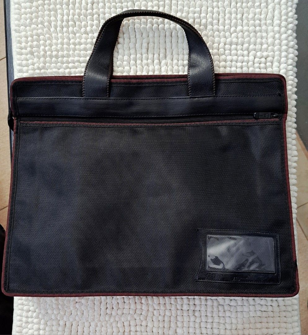 Document Bag Laptop Bag (Category: Laptop Bags & Sleeves) located in Quezon City. Submitted by kirstenbella (Listing ID 1317466442, Image 2). Description: Thick Nylon and leather material very sturdy like brandnew in actual can fit legal size folder perfect fit for laptop as well H 12 x W 14.5 x D 3 Inches NO Issues Pristine condition Gandara nito besh 📞 You may reach me through: Text, RCS, Vib@r, Telegr@m, or Wh@tsApp using the number listed in