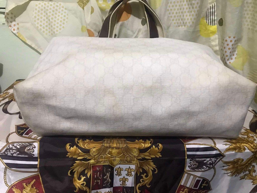 Gucci tote bag (Category: Luxury Bags & Wallets) located in Caloocan City. Submitted by bingsky312 (Listing ID 1317503270, Image 3). Description: Gucci cherry line With yellowish canvas and inner lining on some portion. Some tears on the leather piping along lips. No holes.
