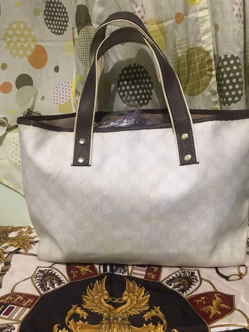 Gucci tote bag (Category: Luxury Bags & Wallets) located in Caloocan City. Submitted by bingsky312 (Listing ID 1317503270, Image 2). Description: Gucci cherry line With yellowish canvas and inner lining on some portion. Some tears on the leather piping along lips. No holes.