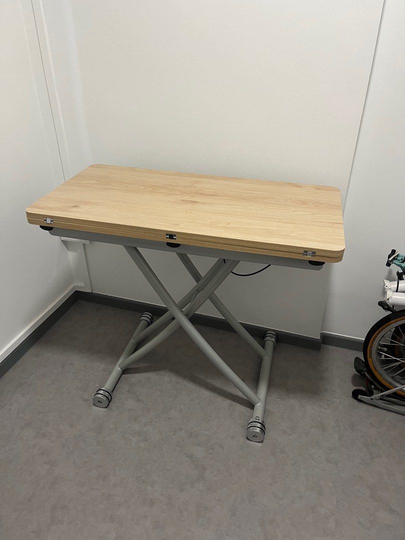 Adjustable Dining Coffee Table (Category: Tables & Sets) located in Singapore. Submitted by otterick (Listing ID 1312377211, Image 1). Description: Slight used, selling cause moved house. Can adjust upwards and downwards can also open up to make a square table. Arrange your own delivery .