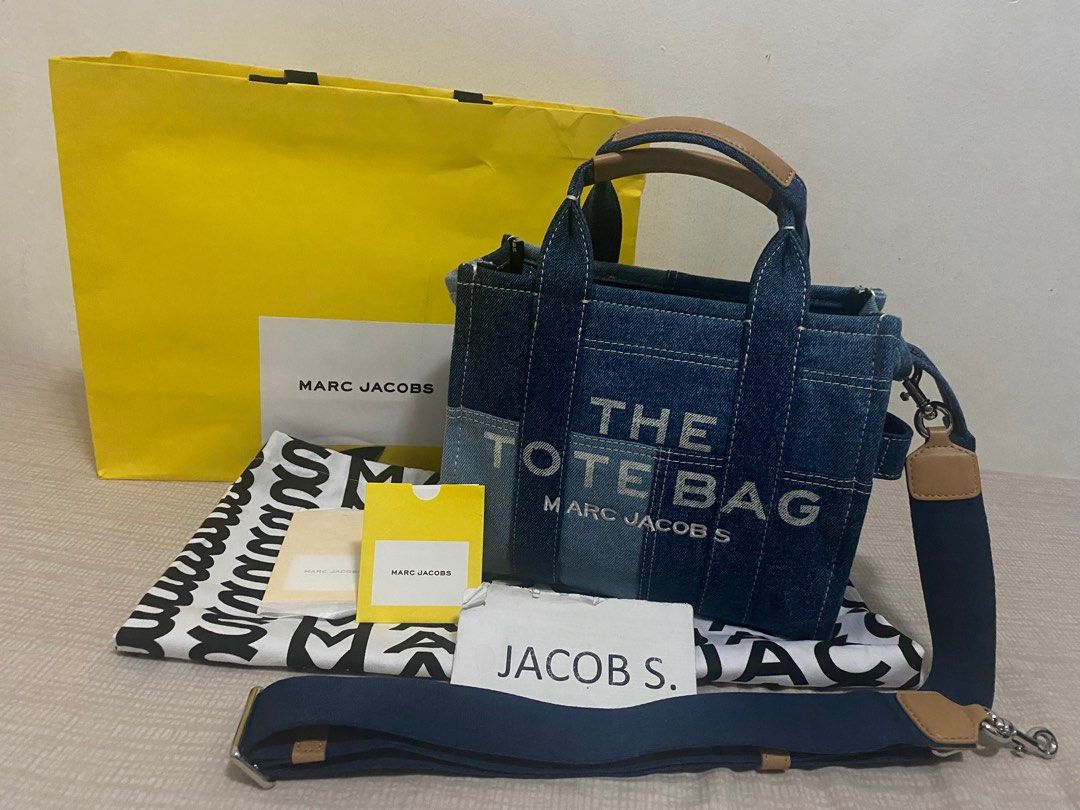 Marc Jacobs The Tote Bag Blue Denim (Category: Luxury Bags & Wallets) located in Mandaluyong City. Submitted by songco07 (Listing ID 1312321955, Image 1). Description: Marc Jacobs The Tote Bag Blue Denim Size small Used Comes with dust bag, care card, paper bag 7,900+sf.