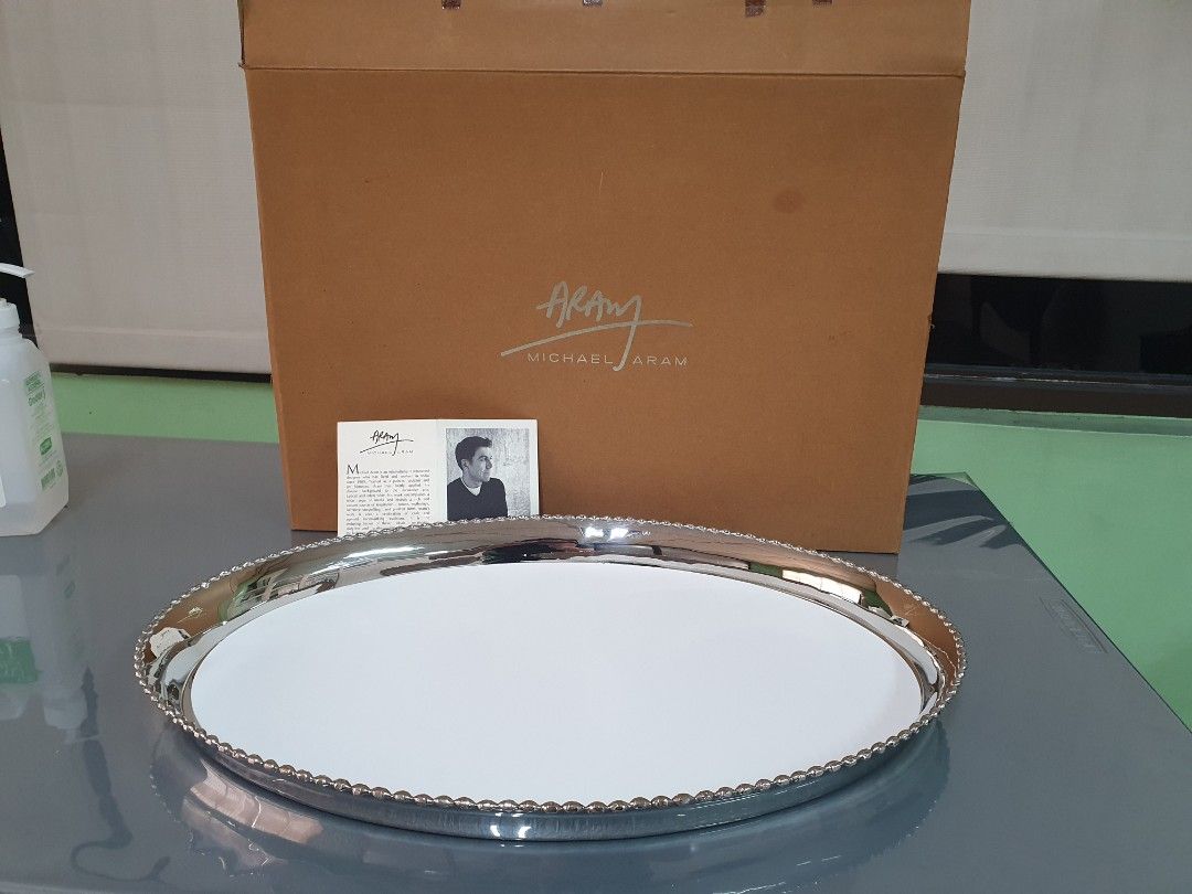 Michael Aram Large Silver Platter with Mat (Category: Dinnerware & Cutlery) located in Quezon City. Submitted by treasuredcollectibles (Listing ID 1312310023, Image 1). Description: Michael Aram Large Platter with Mat made out of metal, color silver brand new, never been used length: 46cm width: 33cm height:4cm rfs: decluttering payment method: Gcash or bank transfer Location: Quezon City pick or delivery. buyer shoulders shipping fee.