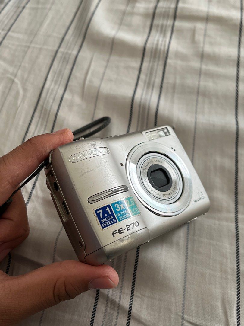 Olympus Fe-270 (Untested Unit) (Category: Cameras) located in Manila. Submitted by rayyyyyarchives (Listing ID 1312336988, Image 1). Description: Olympus Fe-270 - 7.1 megapixels -3x optical Zoom Issues: - untested unit (this unit may or may not work, I dont have the batteries for it so I can’t test it out) - Has a lot of scratches on the back part of the camera (can be seen on photos) - unit only (no charger, no battery) - sf should be shouldered