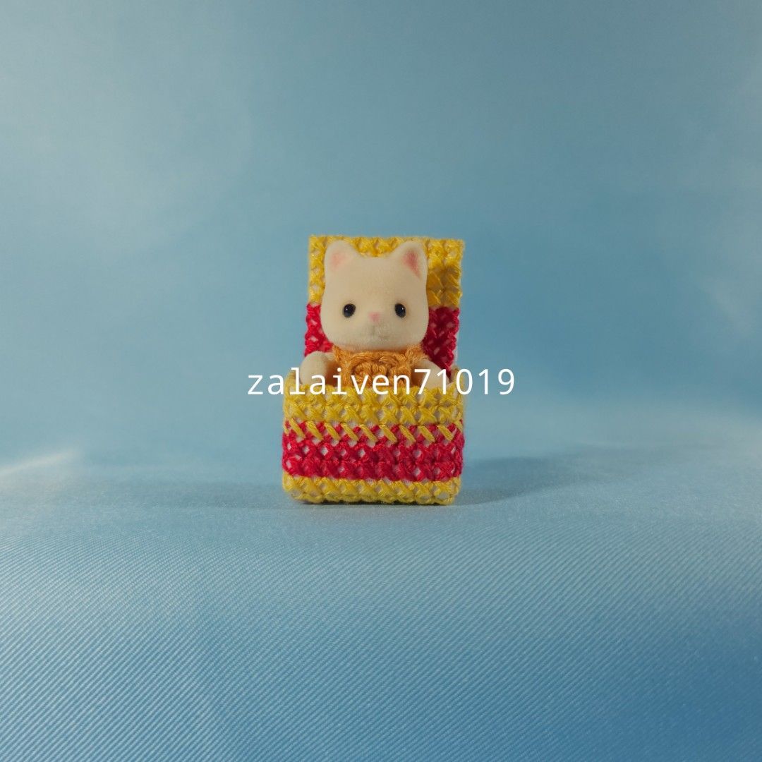 Sylvanian Families | Silk Cat baby with magenta and yellow bed (Category: Vintage Collectibles) located in Manila. Submitted by zalaiven71019 (Listing ID 1301466389, Image 3). Description: The baby was kept in storage away from light and in a smoke-free house. It is like new. The bed is handmade cross-stitch and the romper is crochet, all included in your purchase. I am currently decluttering and am selling things I don't have space for anymore. 