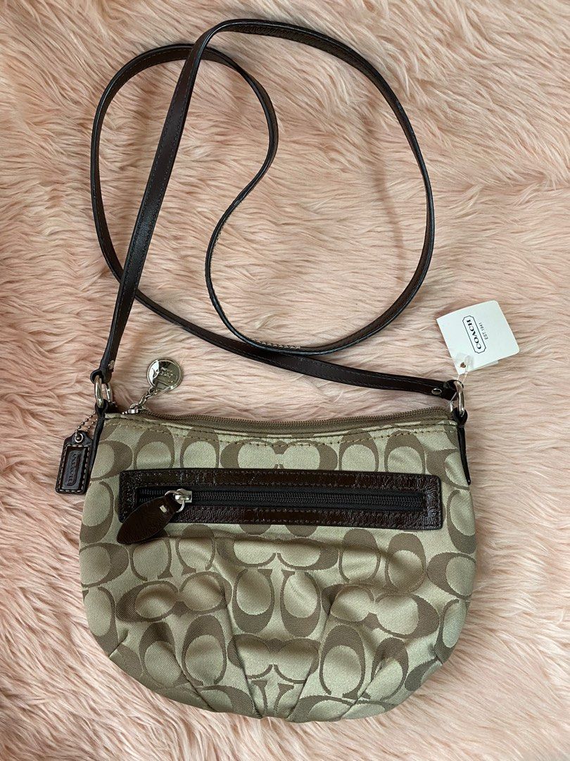 COACH small slingbag (Category: Luxury Bags & Wallets) located in Quezon City. Submitted by goodstuff_4sale (Listing ID 1312503613, Image 1). Description: new w tag COACH signature sateen swing pack/crossbody/ shoulder bag sv / khaki/mahogany jacquard fabric strap not adjustable embossed medallion pull tab 9 x 6.5 x 1.5” cute Gcash grab lalamove jrs j&t .