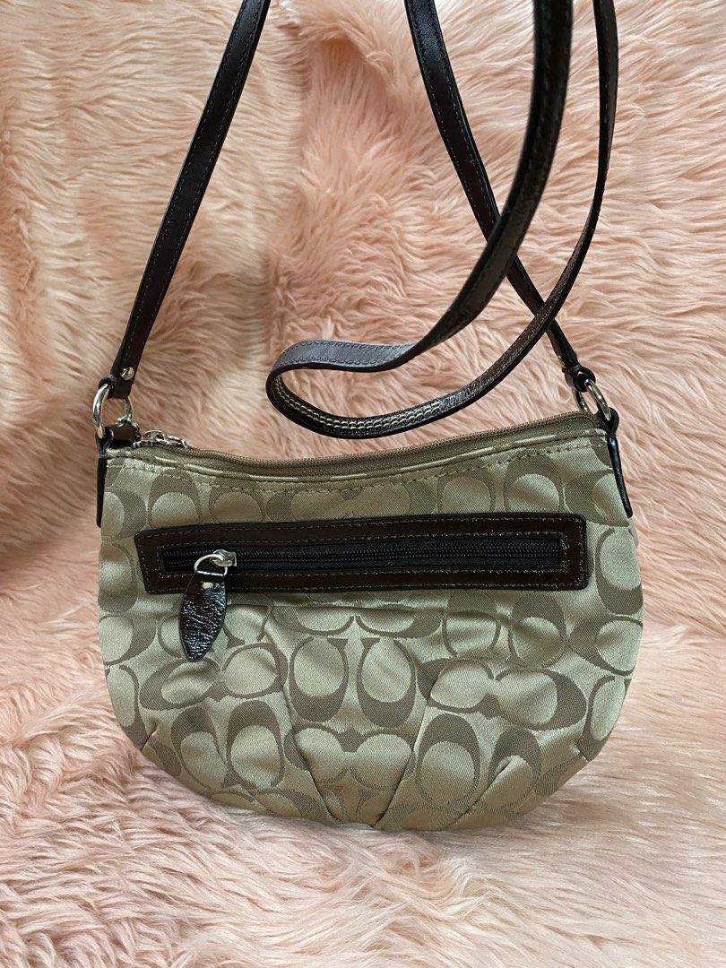 COACH small slingbag (Category: Luxury Bags & Wallets) located in Quezon City. Submitted by goodstuff_4sale (Listing ID 1312503613, Image 3). Description: new w tag COACH signature sateen swing pack/crossbody/ shoulder bag sv / khaki/mahogany jacquard fabric strap not adjustable embossed medallion pull tab 9 x 6.5 x 1.5” cute Gcash grab lalamove jrs j&t .