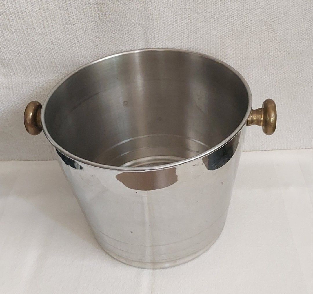 ICE BUCKET (Category: Other Kitchenware & Tableware) located in Rodriguez. Submitted by grace4marl (Listing ID 1312586092, Image 1). Description: • Italy • Stainless • Rustproof • Brass handles •Thick •Measurement: Height - 8 inches Top diameter - 10 inches Bottom diameter- 7.5 in. Note: Bottle of wine not included; for reference only..