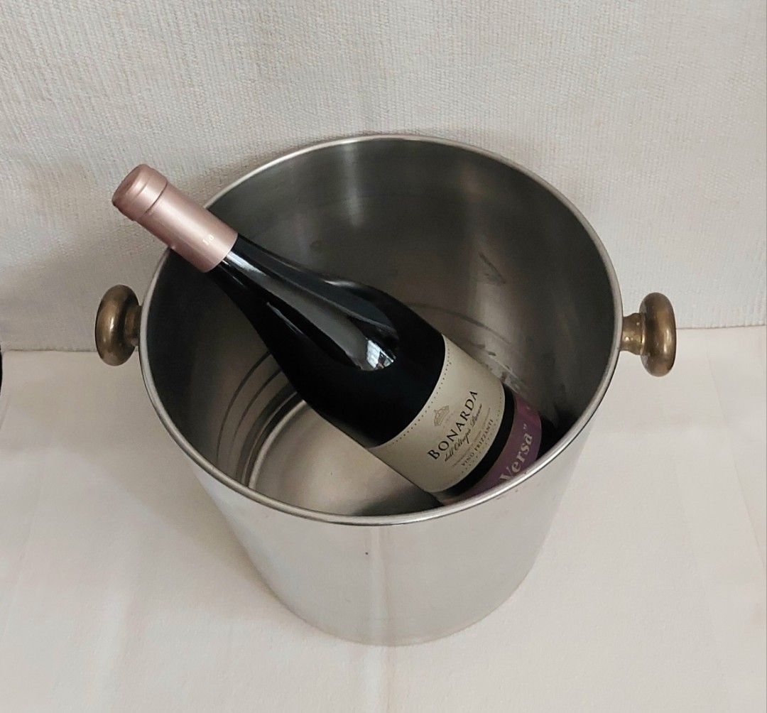 ICE BUCKET (Category: Other Kitchenware & Tableware) located in Rodriguez. Submitted by grace4marl (Listing ID 1312586092, Image 3). Description: • Italy • Stainless • Rustproof • Brass handles •Thick •Measurement: Height - 8 inches Top diameter - 10 inches Bottom diameter- 7.5 in. Note: Bottle of wine not included; for reference only..