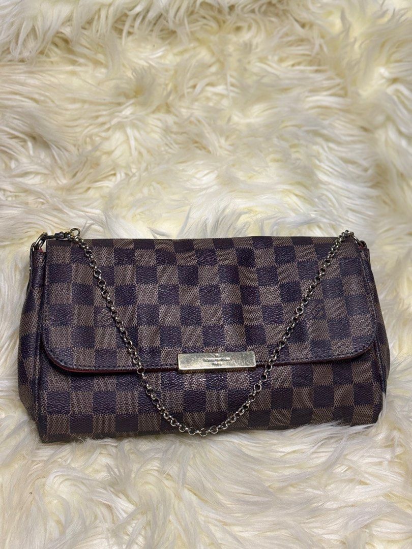 Loui Vuitton Favorite (Category: Luxury Bags & Wallets) located in Muntinlupa City. Submitted by demrixxx27 (Listing ID 1312594410, Image 1). Description: Louis Vuitton Favorite Damier Ebene MM Red Lining.