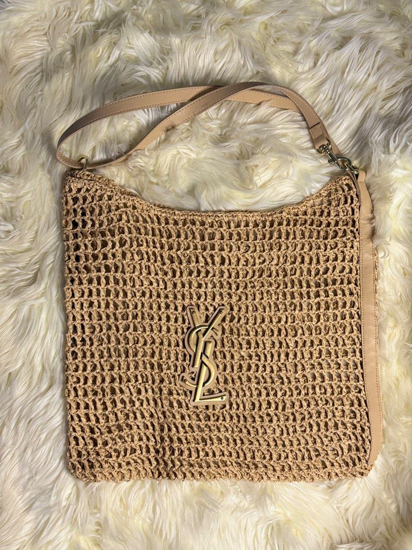 raffia crochet tote bag (Category: Luxury Bags & Wallets) located in Muntinlupa City. Submitted by demrixxx27 (Listing ID 1312554992, Image 3). Description: This Saint Laurent tote bag features a monochromatic design made from natural raffia in a beige hue. The iconic YSL initials decorate the front of the acessory..