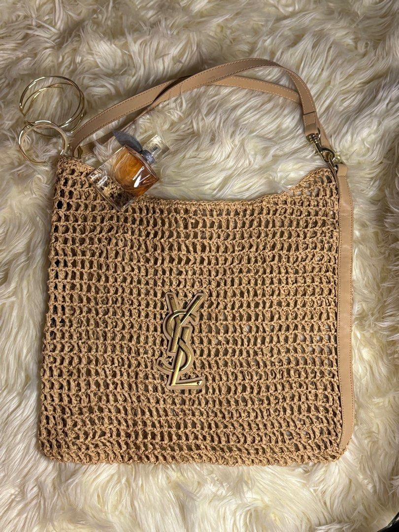 raffia crochet tote bag (Category: Luxury Bags & Wallets) located in Muntinlupa City. Submitted by demrixxx27 (Listing ID 1312554992, Image 2). Description: This Saint Laurent tote bag features a monochromatic design made from natural raffia in a beige hue. The iconic YSL initials decorate the front of the acessory..