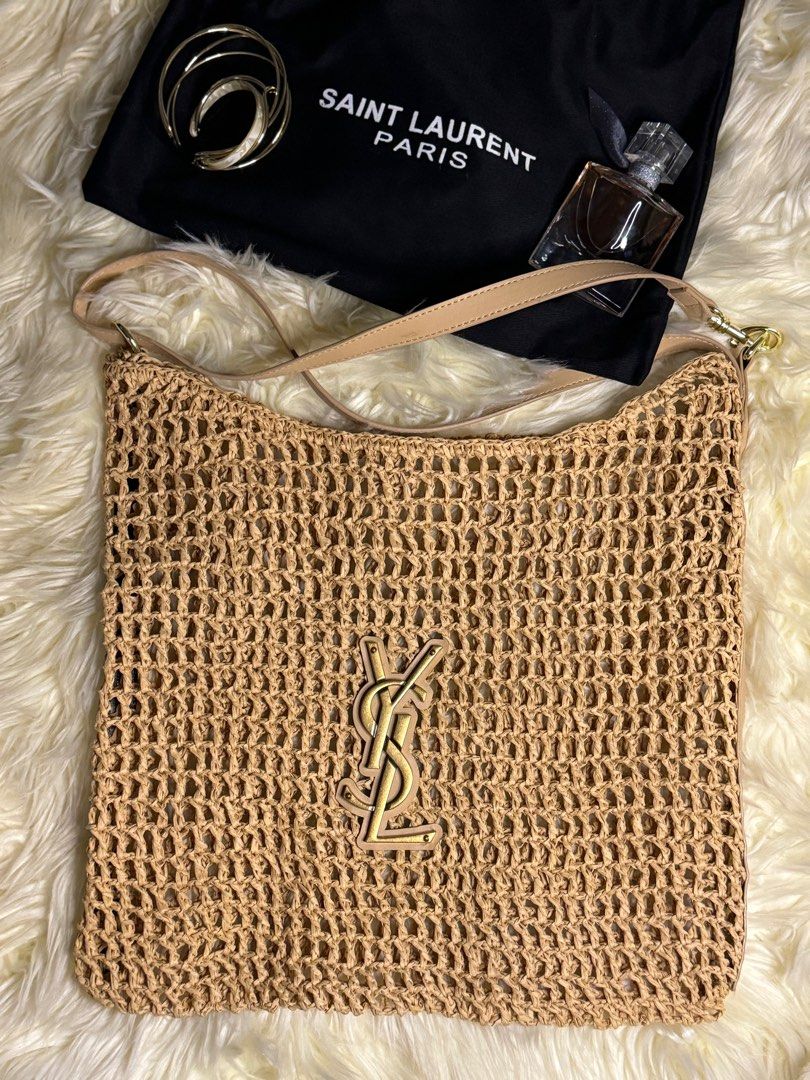raffia crochet tote bag (Category: Luxury Bags & Wallets) located in Muntinlupa City. Submitted by demrixxx27 (Listing ID 1312554992, Image 1). Description: This Saint Laurent tote bag features a monochromatic design made from natural raffia in a beige hue. The iconic YSL initials decorate the front of the acessory..