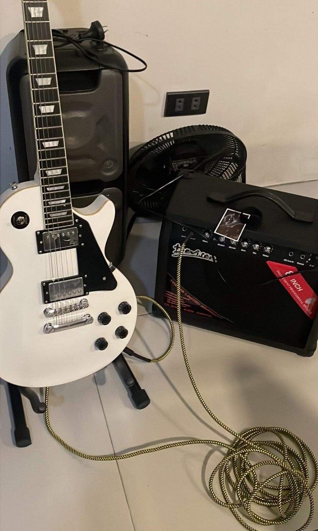 thomson les paul standard electric guitar (Category: Musical Instruments) located in Ramon. Submitted by arixee (Listing ID 1312643246, Image 1). Description: thomson les paul standard electric guitar with 30watts amplifier and 2 fender vintage 6cm wire/connector + w free guitar stand and strap dm for price.