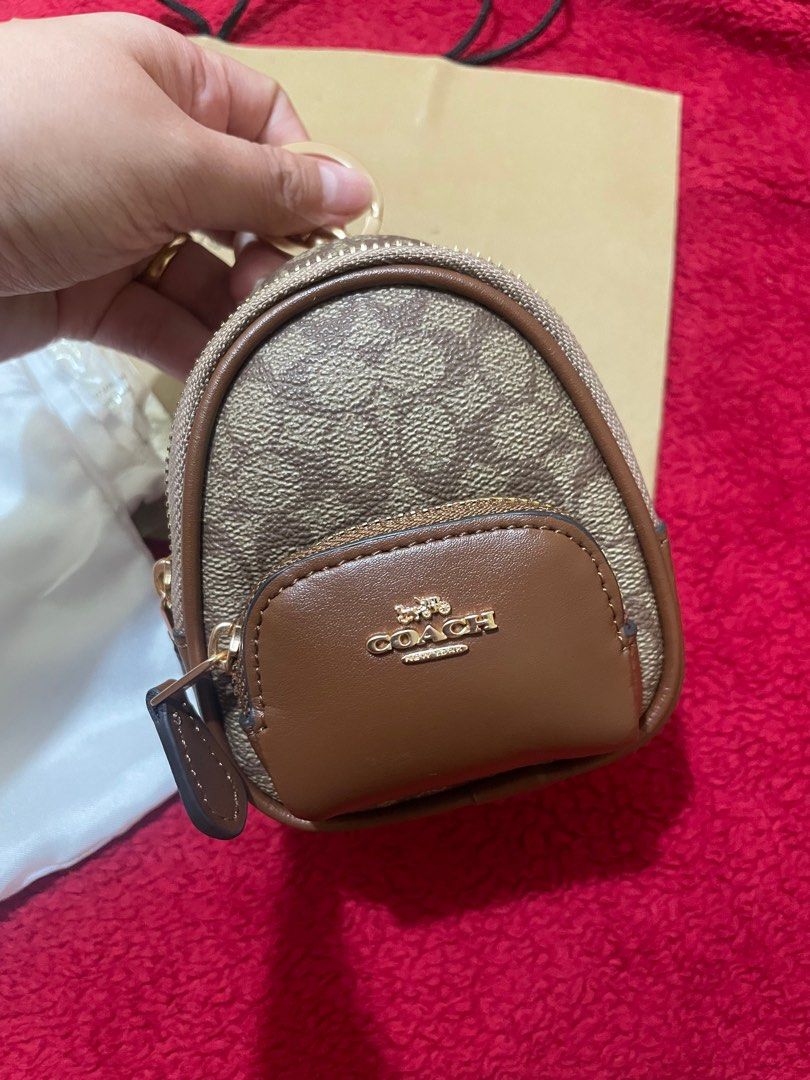 Coach Court Mini Backpack / Keychain (Category: Luxury Bags & Wallets) located in Manila. Submitted by chesses (Listing ID 1312817484, Image 3). Description: Coach Court Mini scrap bag / hanging bag😍😍 Size: 11*9 cm Super cute. You can use it as a keychain or hang it on your bag 😁 Can hold many cute size stuffs inside. SF c/o buyer.