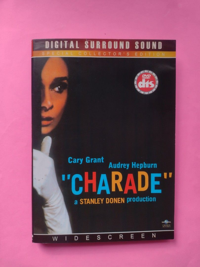 DVD Movie : " Charade " (Category: Storybooks) located in Quezon City. Submitted by yesteryearscorner (Listing ID 1312715724, Image 1). Description: This '60s suspense classic is about a young American in Paris ( played by Audrey Hepburn ) who flees a trio of crooks who are trying to recover the fortune her late husband stole from them . The only person she can trust is a suave stranger ( Cary Grant ) . This film is a deliciously dark comedic thr