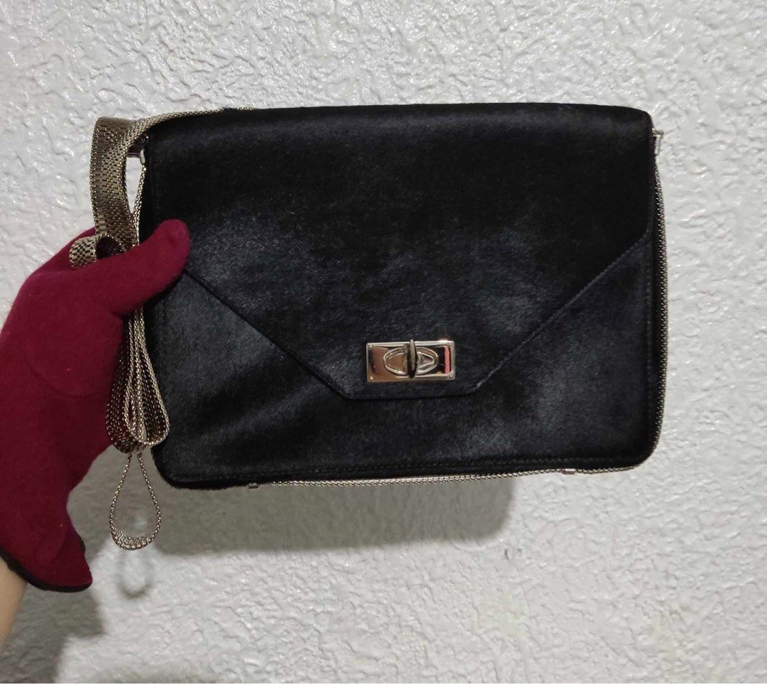 Givenchy Shark Tooth Lock Sling Bag (Category: Luxury Bags & Wallets) located in Paranaque City. Submitted by dalle_closet (Listing ID 1312743952, Image 1). Description: small size very elegant bag Fur yung material niya outside kaya medyo shiny po not faded yan super nice pa sa actual silver na silver pa mga hardwares kahit strap nya.