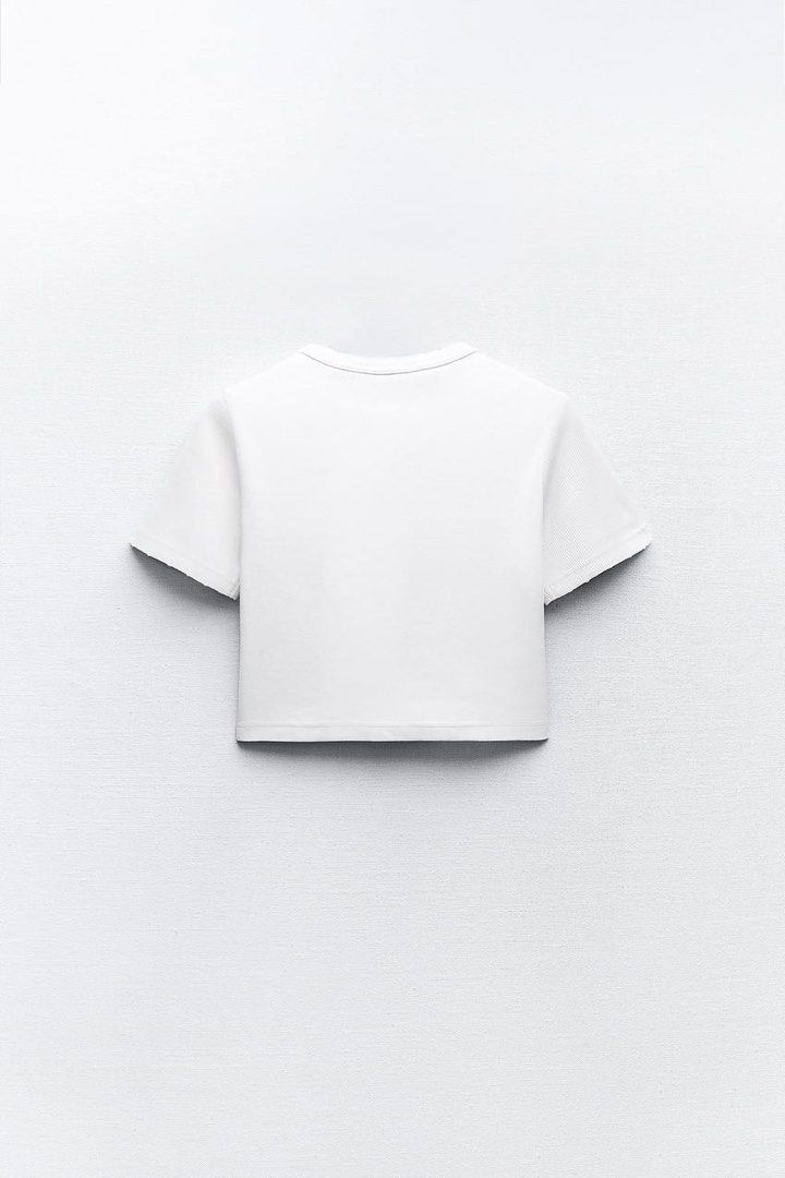 Overrun ZARA White Ribbed Crop Top (Category: Shirts) located in Manila. Submitted by curatedbyelvynna (Listing ID 1312778464, Image 2). Description: Condition: 5/5, no flaws 💯 No when worn, no ‘more photos’. All photos are posted, what you see is what you’ll get. Last price posted 💯 No more haggling. All items are reasonably priced based on their condition. No Sho/pee checkout. All sales are final. No returns. Courier: GoGo Xpress (shipping st