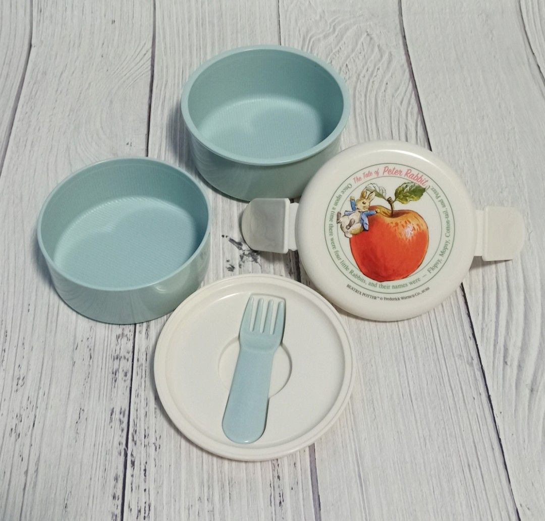 Peter Rabbit 2 tier Round Lunchbox (Category: Food Organization & Storage) located in Bacoor. Submitted by japanice_aniks (Listing ID 1312751478, Image 2). Description: FIXED PRICE Total Capacity: 500ml (top layer: 230ml | bottom: 270ml) with fork Made in Japan.