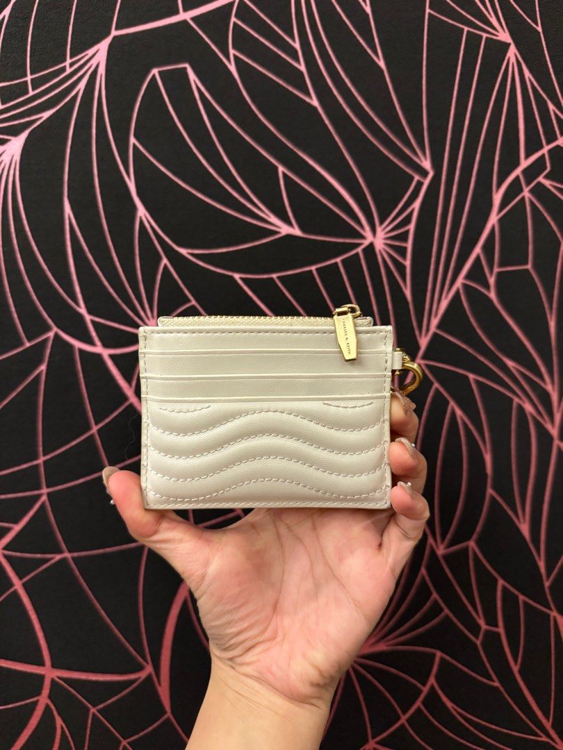 RUSH SELL!! AUBRIELLE STITCH-TRIM ZIP CARD (Category: Wallets & Card holders) located in Manila. Submitted by chiungums (Listing ID 1312966619, Image 3). Description: rfs : downsizing my card holders / not using it anymore condition : still good / signs of usage only color : cream 100% authentic ( bought in bgc highstreet ) .