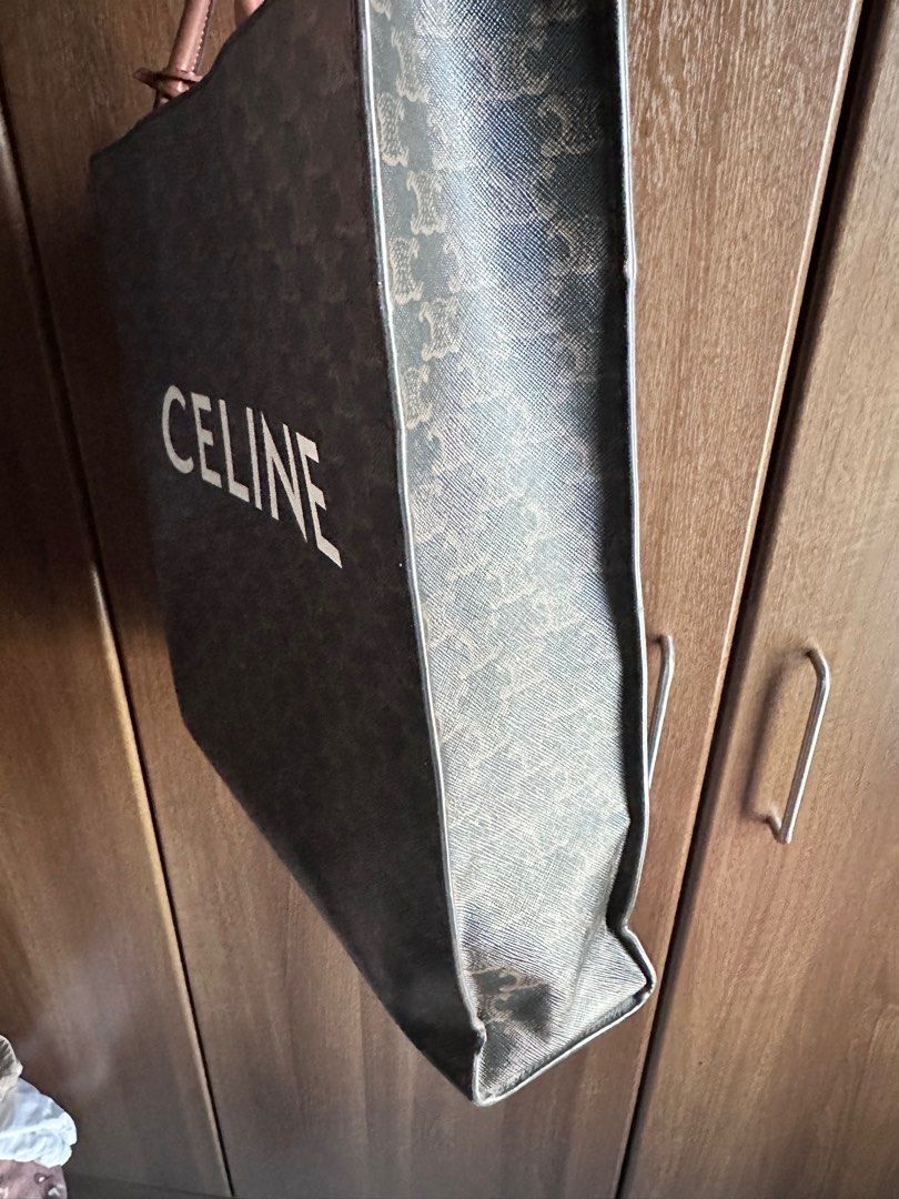 Authentic Celine Vertical Triomphe Cabas Tote (Category: Luxury Bags & Wallets) located in Rizal. Submitted by SummerPeaCloset (Listing ID 1312974486, Image 3). Description: Celine Dark Brown Triomphe Coated Canvas and Leather Medium Vertical Cabas Tote Guaranteed Authentic This design has no long strap With lock and key and provided dustbag Dimensions: Length 36 cm Width 10 cm Height 38 cm Handle Drop 16 cm Pls check the last photo for the minor