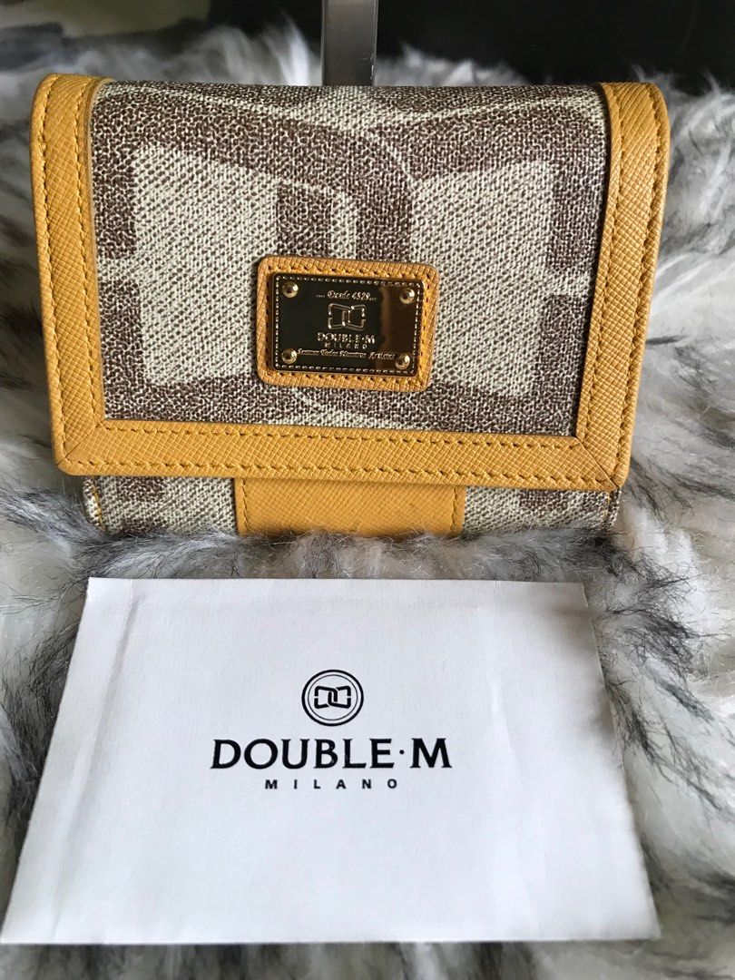 Double M Milano Trifold Wallet (Category: Luxury Bags & Wallets) located in Santa Rosa. Submitted by rina.rina3 (Listing ID 1312877791, Image 1). Description: Double M Milano trifold wallet Preowned from Korea, look new (seems not used at all!) Very good hardwares Has a lot of compartment: -double bills compartments with 2 card slots in bills compartment - at least 4-6 card slots on other areas - zippered compartment for coins - 2 picture slots o