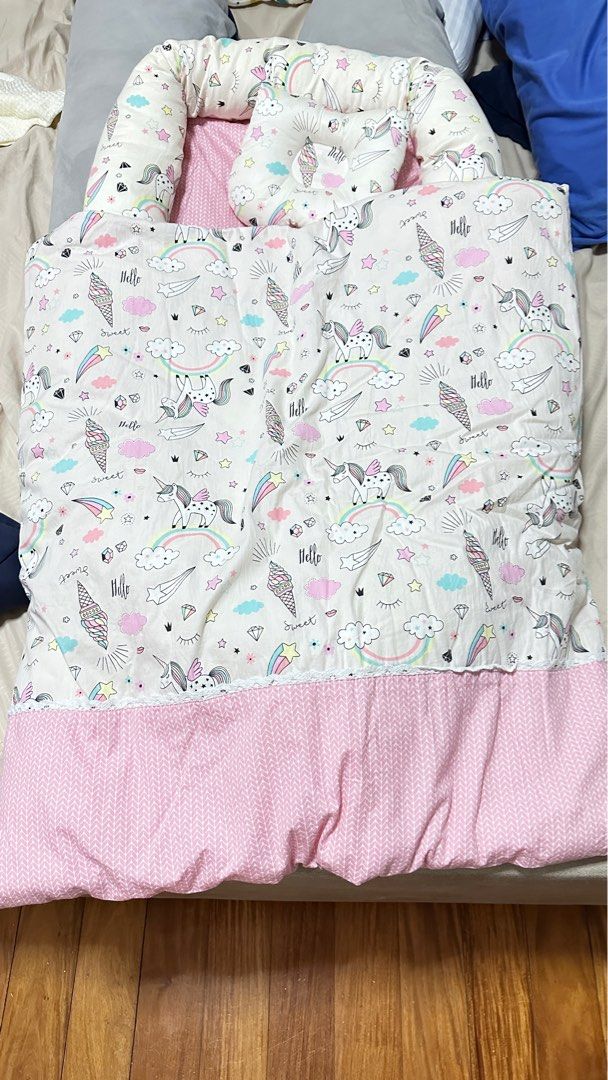 Mambo Bed Nest - Unicorn (Category: Cots & Cribs) located in Quezon City. Submitted by debbiejaneang (Listing ID 1312837274, Image 2). Description: Mambo nest bedding set is a portable and travel bed, a play mat and even a diaper changing mat and a co sleeper. This newborn baby products are firm but soft foam mattress gives extra support and comfort. Ribbons can be opened ,simply loosen the ribbon at the end of the bumpers to make the size larger
