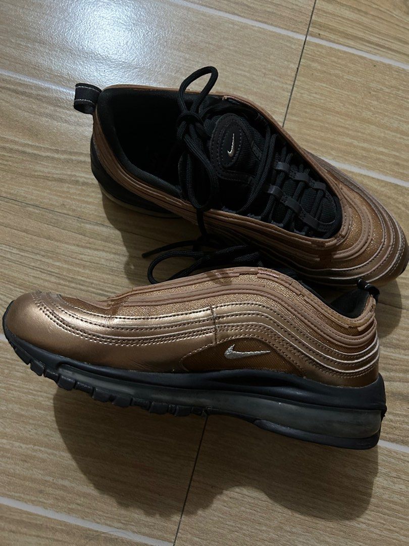 Nike Air Max 97 Copper (Category: Sneakers) located in Makati City. Submitted by declutterwjn_ (Listing ID 1312972103, Image 2). Description: Used and has some cracks as seen on the photos but are not noticeable from afar. Still usable though. .