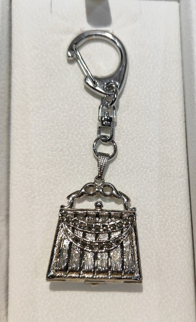 Silver Stainless Steel Purse Keychain (Category: Charms) located in General Trias. Submitted by silverstar1221 (Listing ID 1312948901, Image 1). Description: Item Name: Silver Stainless Steel Purse Keychain Item Description: • Bought from Japan Auction •AS-IS Rules and Policy: • No Meet Up • No COD • Shipping or Delivery Only. • No cancellation once order is placed. Please finalized your order to avoid problems for both the seller and buyer. • No