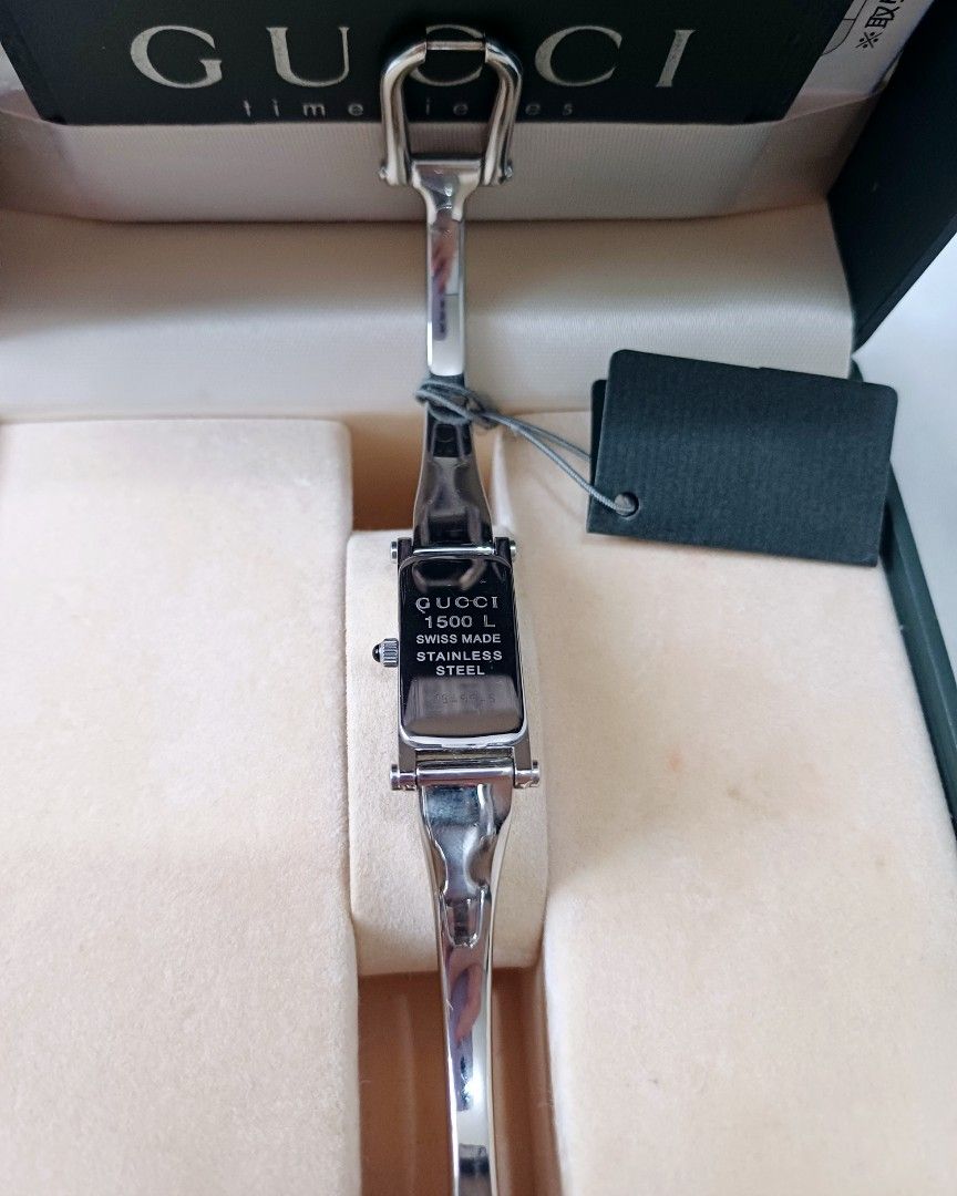 Authentic GUCCI 1500L Vintage Bangle Watch (Category: Luxury Watches) located in Las Pinas. Submitted by hmhcollection (Listing ID 1313111434, Image 2). Description: Rare find! 💯 Authentic Vintage Gucci 1500L Black Dial Watch Stainless Steel Swiss Made Quartz Dainty Ladies Horsebit Bought from Japan with minimal hairlines Inclusions: box, booklet, tag, card and paper bag.