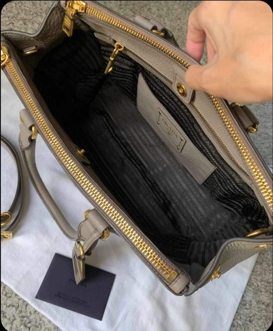 Authentic Prada bag (Category: Bags & Wallets) located in Singapore. Submitted by reign105 (Listing ID 1313079021, Image 3). Description: Lightly used grey prada bag. It is authentic..