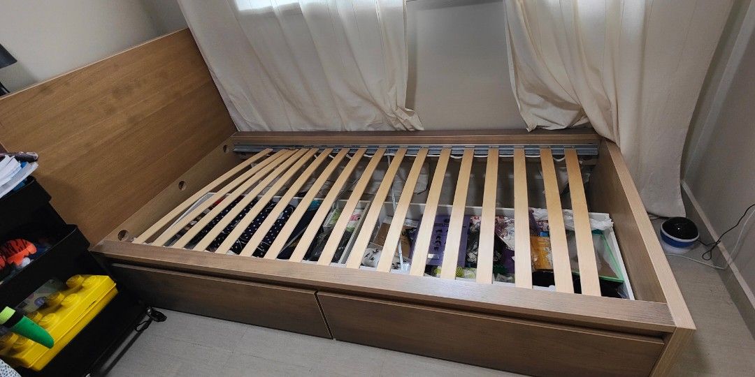 Bed frame (Category: Bed Frames & Mattresses) located in Singapore. Submitted by ishmamnor (Listing ID 1313098967, Image 1). Description: Bed frame IKEA With 2 storage drawers beneath. 210cm x 106cm Brand new is $319 Used for 2 years, still sturdy. Arrange own transport.