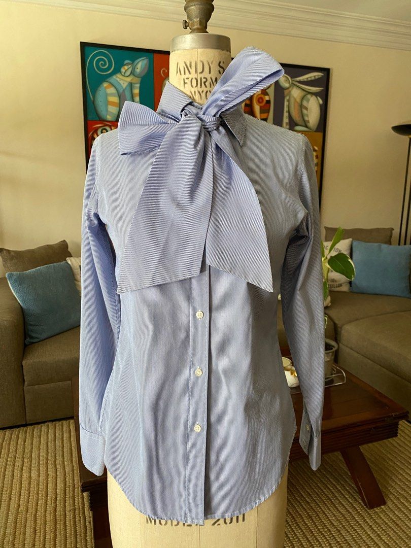 GAP Pussy Bow Blouse (Category: Blouses) located in Mandaluyong City. Submitted by declutteringmodenow (Listing ID 1313074010, Image 1). Description: Super cute pussy bow blouse by the GAP with detachable ribbon, so it can be worn like a regular button down shirt too. Size 0, fitted and fits XS..