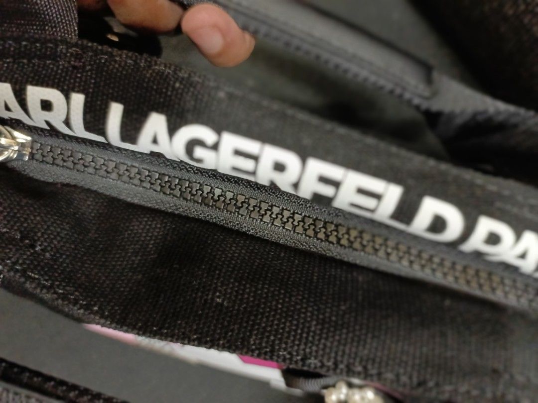 KL canvas sling bag (Category: Cross-body Bags) located in Quezon City. Submitted by G.E.M18 (Listing ID 1313092658, Image 2). Description: KL canvas sling bag. Lost tag Length: 10inches Height: 7inches.