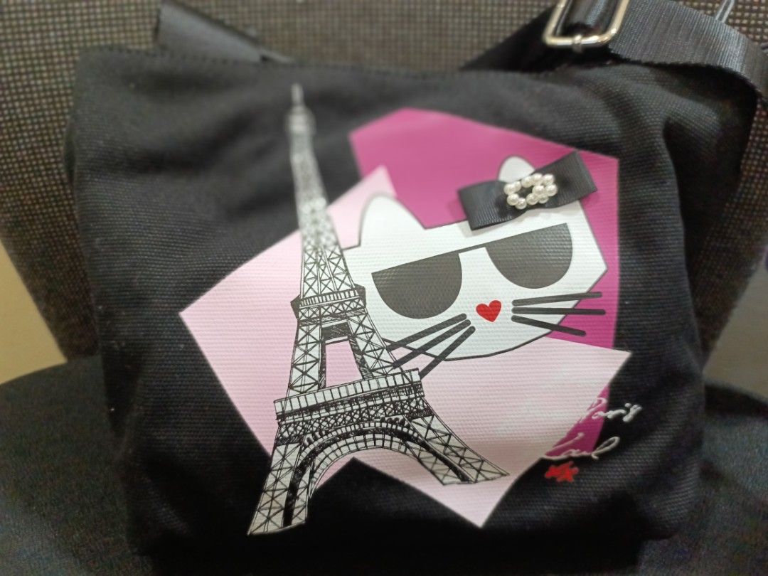 KL canvas sling bag (Category: Cross-body Bags) located in Quezon City. Submitted by G.E.M18 (Listing ID 1313092658, Image 1). Description: KL canvas sling bag. Lost tag Length: 10inches Height: 7inches.