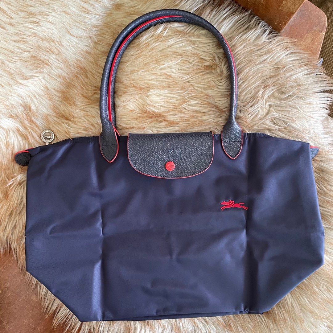 Longchamp Le Pliage in Navy Blue (L) (Category: Luxury Bags & Wallets) located in Cebu City. Submitted by everythingestetik (Listing ID 1313049875, Image 2). Description: Very cute and handy! Can fit a lot of stuff. Perfect if you’re always on the go! 💗 Selected from Japan outlet/surplus shop With care card and tag In very good brand new condition.