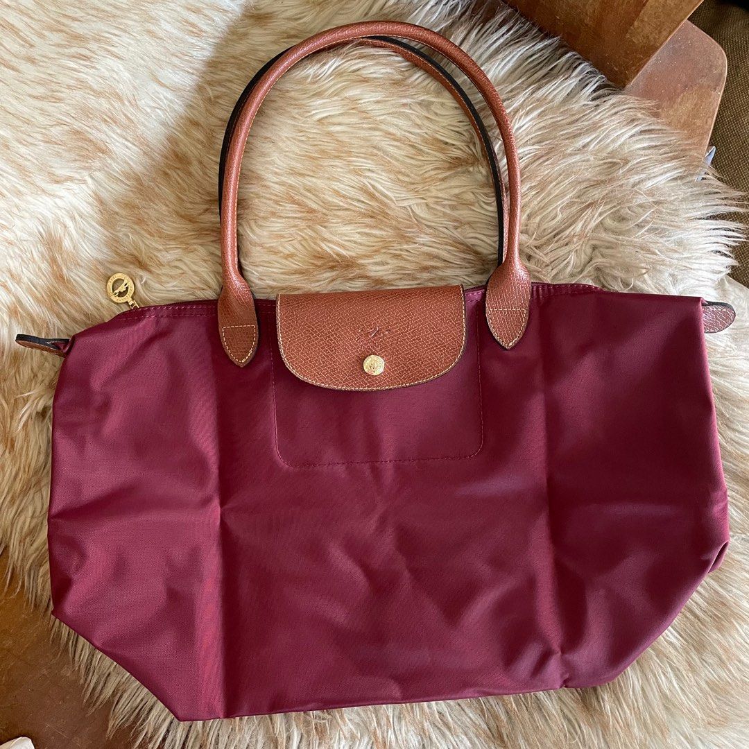 Longchamp Le Pliage in Burgundy (L) (Category: Luxury Bags & Wallets) located in Cebu City. Submitted by everythingestetik (Listing ID 1313050222, Image 2). Description: Very cute and handy! Can fit a lot of stuff. Perfect if you’re always on the go! 💗 Selected from Japan outlet/surplus shop With care card and tag In very good brand new condition.
