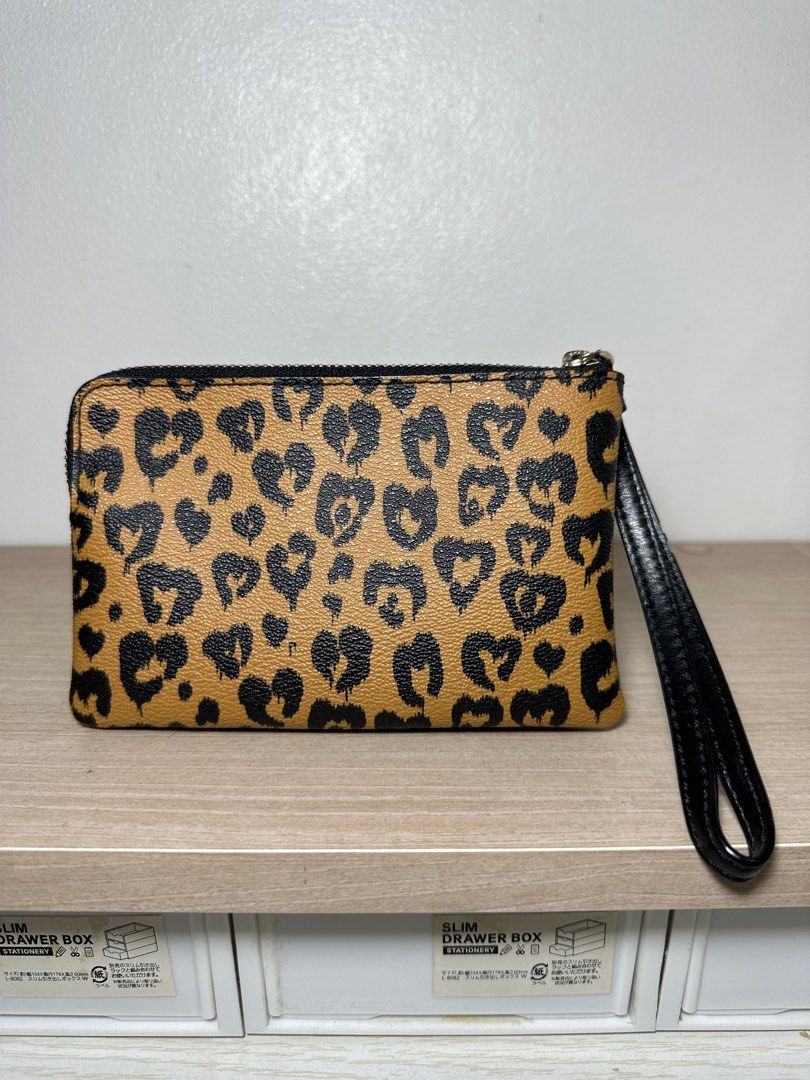 AUTHENTIC Coach Leopard Print Wristlet / Small Wallet (Category: Luxury Bags & Wallets) located in Antipolo. Submitted by bhrl__48 (Listing ID 1313277408, Image 2). Description: - Original price is $78.00 (approx ₱4,500) - AUTHENTIC and in GOOD CONDITION Dimensions: Length: 6 inches Height: 4 inches.