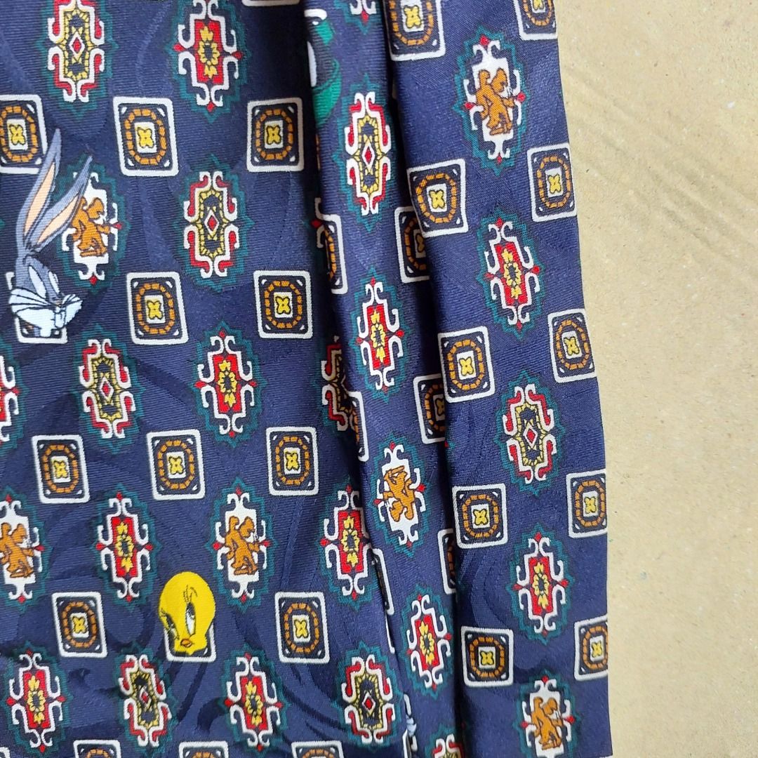 Dark blue looney tunes necktie (Category: Ties) located in Quezon City. Submitted by purplemich (Listing ID 1313232805, Image 2). Description: Decluttering super sale Payment through GCash and BPI. Message me for details..